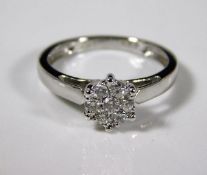 An 18ct white gold ring set with small cluster of