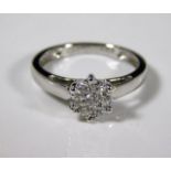 An 18ct white gold ring set with small cluster of