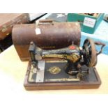 A cased early 20thC. Singer sewing machine