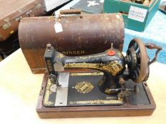 A cased early 20thC. Singer sewing machine
