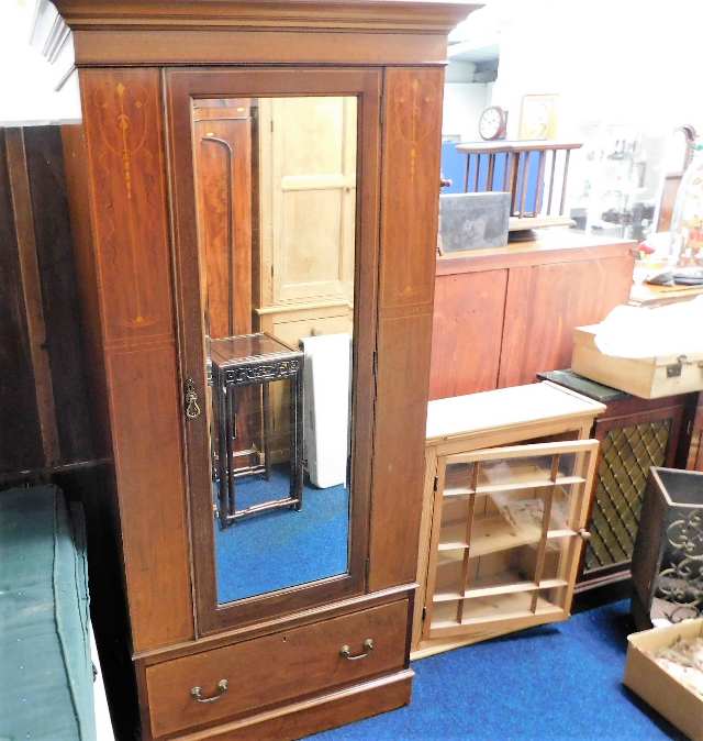 An Edwardian inlaid mahogany single wardrobe with