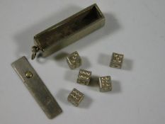 A Chinese marked white metal pendant with dice
