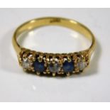 An 18ct gold ring set with diamond & sapphire 3g
