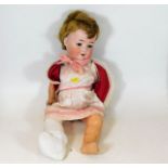 A German porcelain bisque head doll