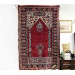 A Persian prayer rug 60in x 39in