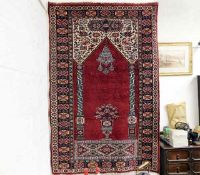A Persian prayer rug 60in x 39in
