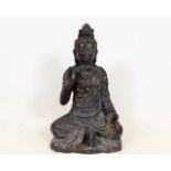 A Chinese cast iron deity 9.25in high x 5.5in wide