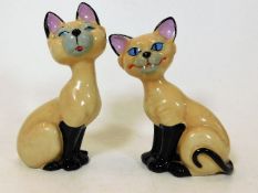 A pair of Wade porcelain Disney Siamese cats