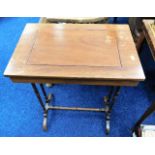 An Edwardian table with secret storage top