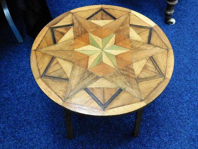 An arts & crafts style inlaid table