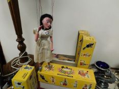 A Pelham puppet figure with box