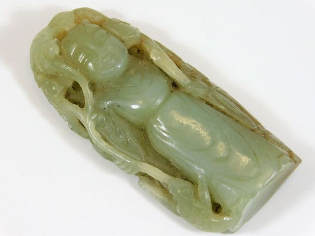 A Chinese carved hardstone amulet 2.75in x 1.25in,
