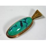 A 14ct gold pendant set with natural turquoise 5.2