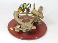 A brass Stanley sextant mounted for display