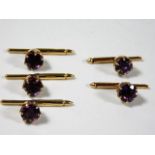 Five 14ct gold button studs set with amethyst 8.1g