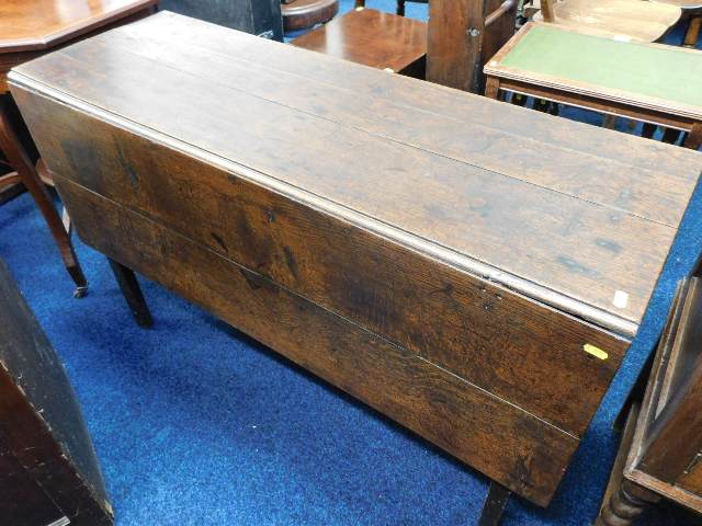 A 19thC. oak drop leaf table, some faults