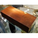 An antique velvet lined mahogany box