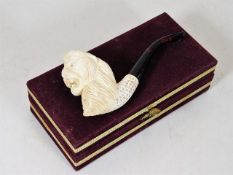 A cased carved meerschaum pipe, unused