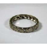 A white metal eternity ring set with diamonds 4.2g