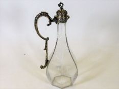 A continental marked silver mounted claret jug of