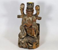 A Chinese polychrome carved wood figure depicting