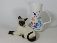 A Beswick Siamese cat twinned with a Poole pottery