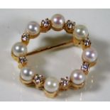 An 18ct gold brooch set with pearl & diamonds 5.6g