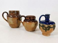 Three small Doulton stoneware jugs