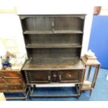 An early 20thC. oak dresser with barley twist legs