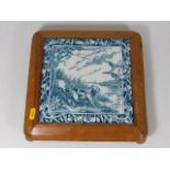 A large decorative mounted tile featuring dog & wi