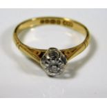 An 18ct gold ring with small illusion set diamond size J 2.3g