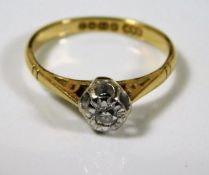 An 18ct gold ring with small illusion set diamond size J 2.3g