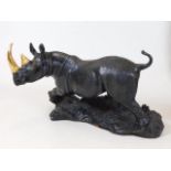 A detailed bronze model of a rhinoceros