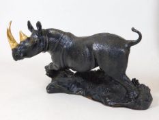 A detailed bronze model of a rhinoceros