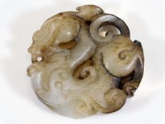 A Chinese carved hardstone amulet depicting dragon
