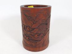 A Chinese bamboo brush pot with carved decor 5.75i