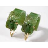 A pair of Chinese carved jade earrings 10.7g with 18ct gold mounts