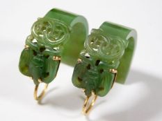 A pair of Chinese carved jade earrings 10.7g with 18ct gold mounts