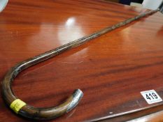 A silver tipped gentleman's cane