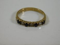 A 9ct gold ring set with diamond & blue stone 1.5g
