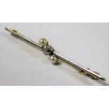 A yellow & white metal bar brooch tests at 18ct set with diamond & natural pearl 3.6g