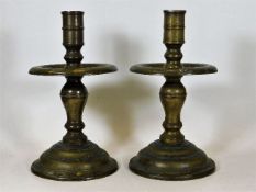 A substantial pair of ecclesiastical style brass candle holders, possibly of Dutch origin, 11.5 high