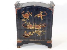 A Japanese lacquerware jewellery chest, lacking on