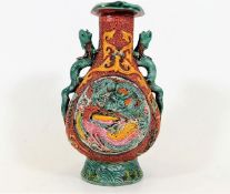 A Chinese polychrome vase decorated with dragons &