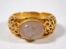 A yellow metal ring, tested at 18ct gold, bearing carved Roman intaglio portrait circa 1-2 A.D. size