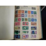 An album of stamps & a large quantity of loose sta