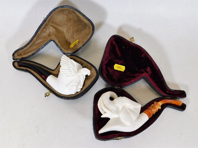 Two carved meerschaum pipes, unused