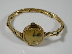 A ladies vintage watch with 9ct gold case & a plat