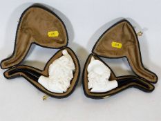 Two carved meerschaum pipes, unused