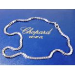A fine quality heavy gauge 18ct white gold necklace by Chopard with original box 35g 16in long & sig